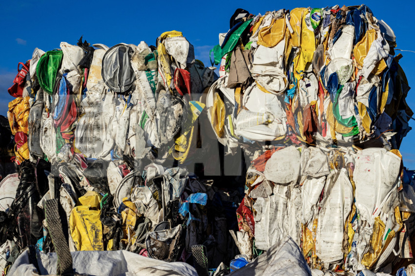 Plastic buckets compressed into bales