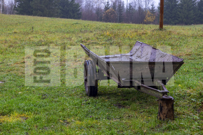 Wooden trailer in autumn with mud
